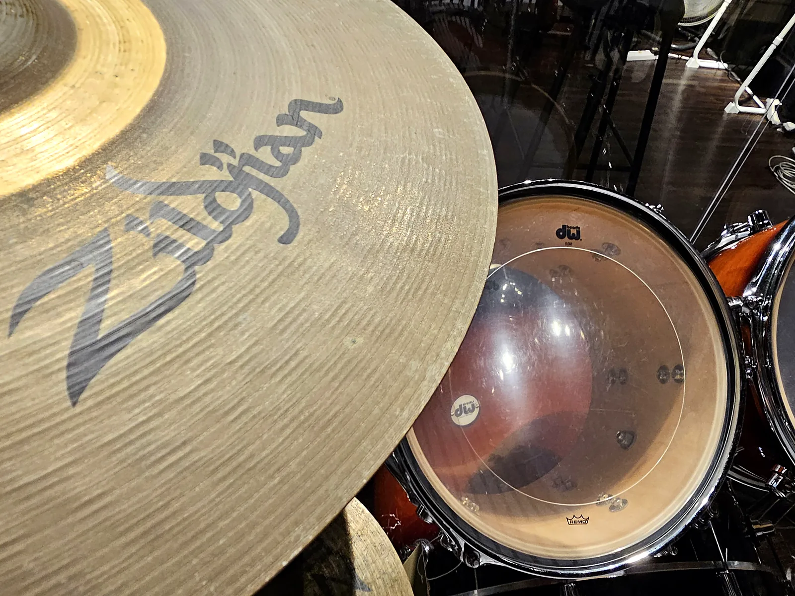 Close-up of a Zildjian cymbal over the DW toms